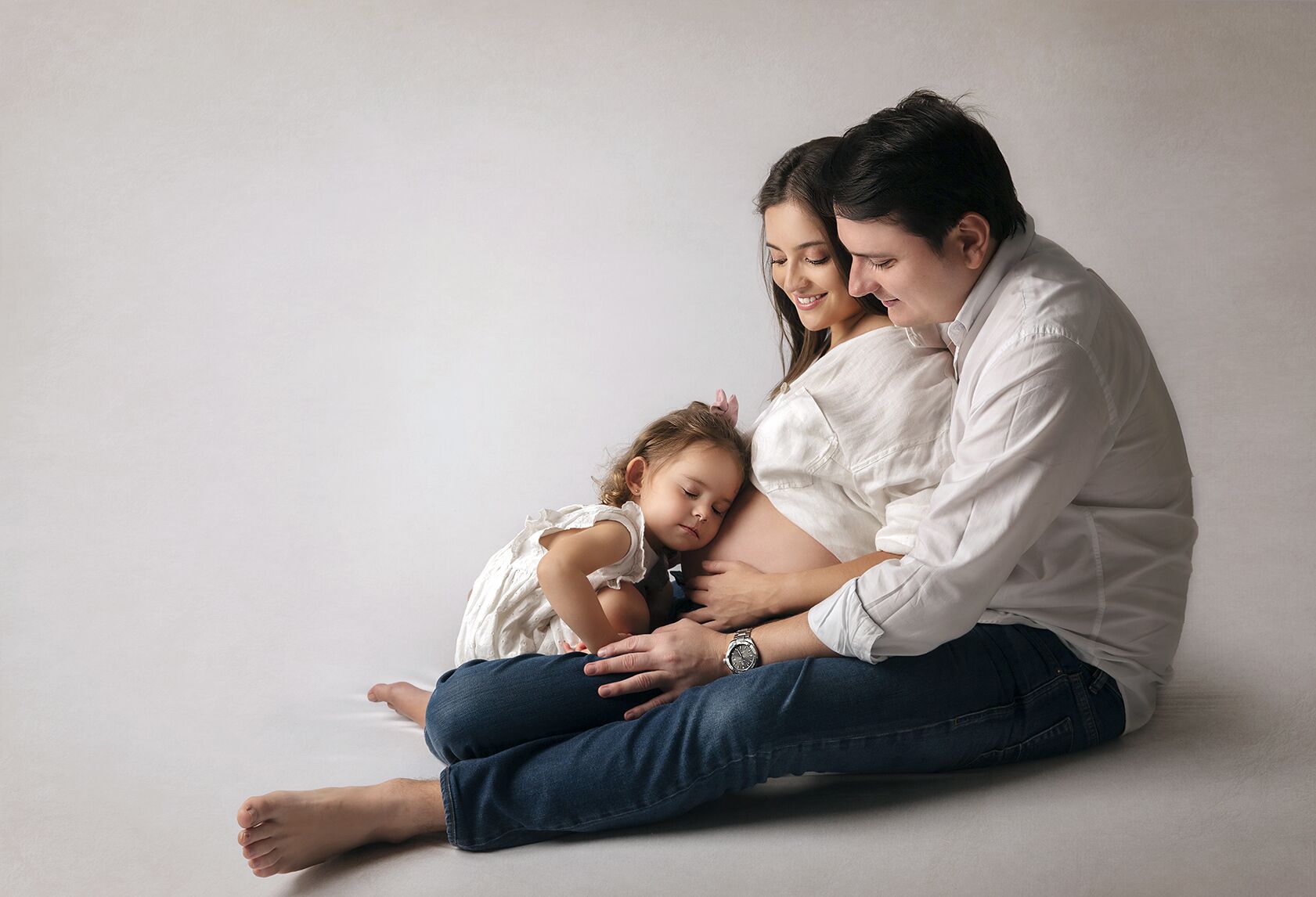 seion de fotos de maternidad con familia