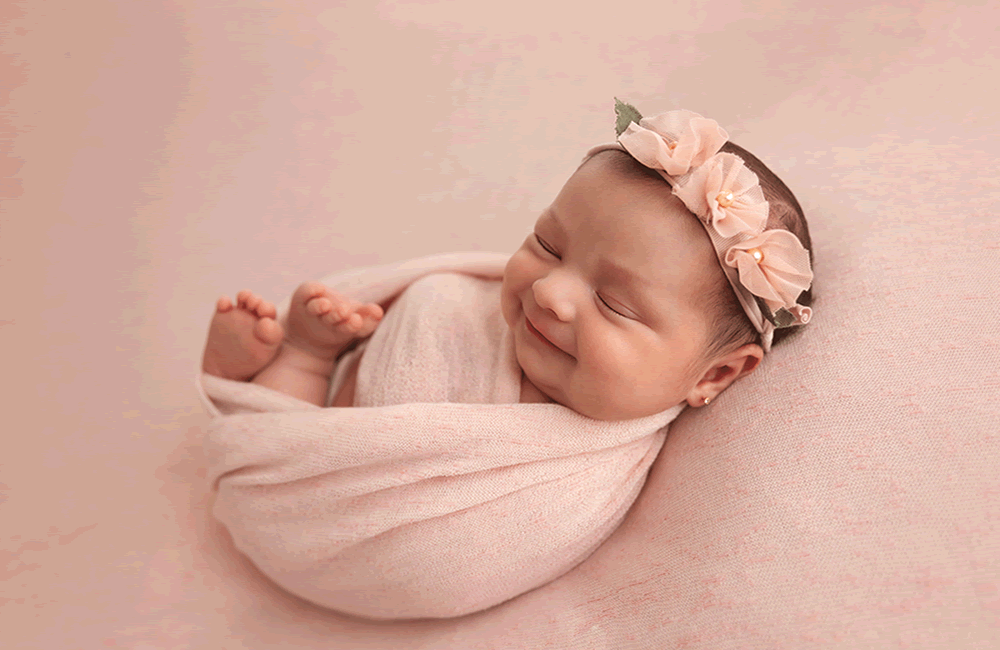 new born in pink