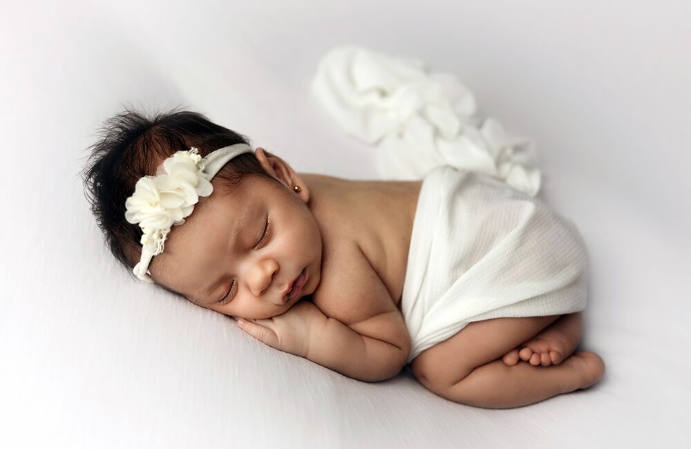 new born in white
